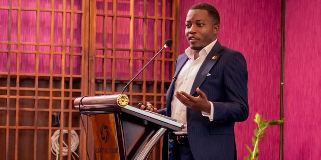 A Kenyan financial executive speaking at a Capital Club event.