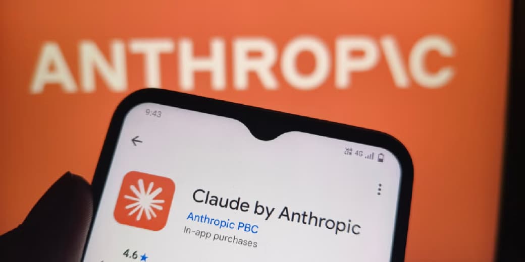 Claude by Anthropic app shown on a phone in front of Anthropic branding.