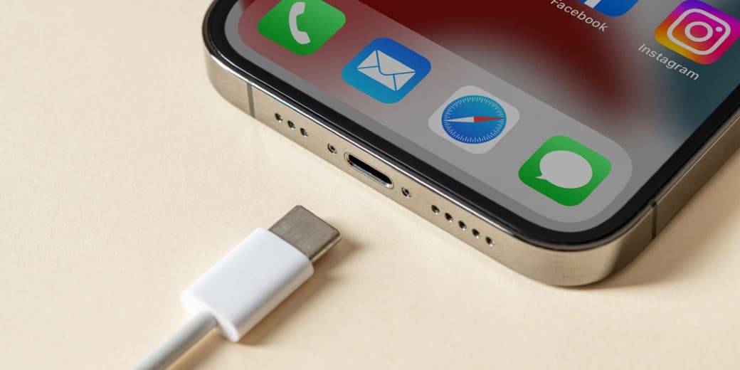 USB-C cable beside an iPhone charging port. Credit: Sky News.