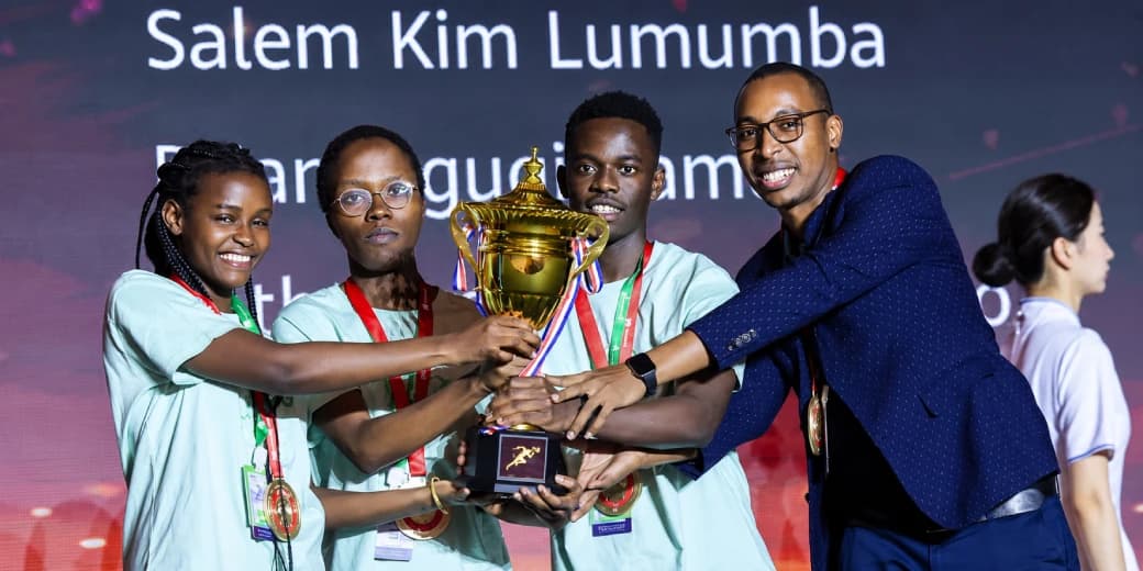 Kenyan competitors holding a trophy after winning at the Huawei ICT Competition.