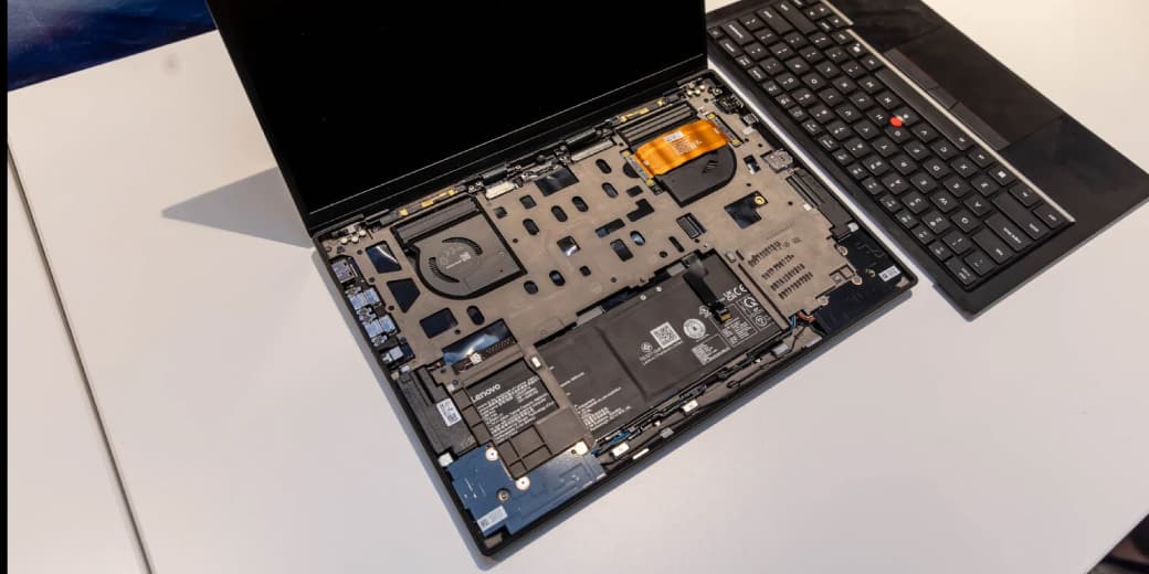 An opened Lenovo ThinkPad X1 Carbon showing internal components.