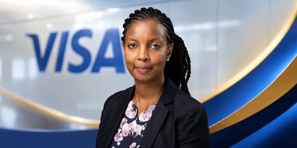 Anne Kinuthia-Otieno pictured in front of a Visa logo.