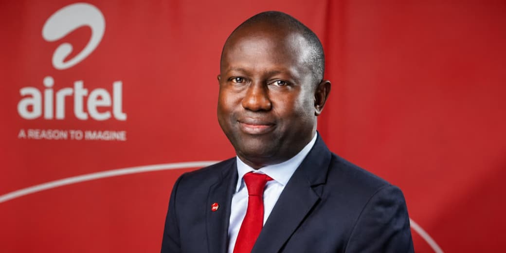 Airtel Kenya executive portrait in front of Airtel branding. Credit: tecMAMBO.