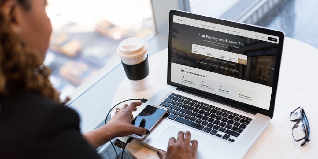 A person browsing a property marketplace on a laptop. Credit: Pexels.
